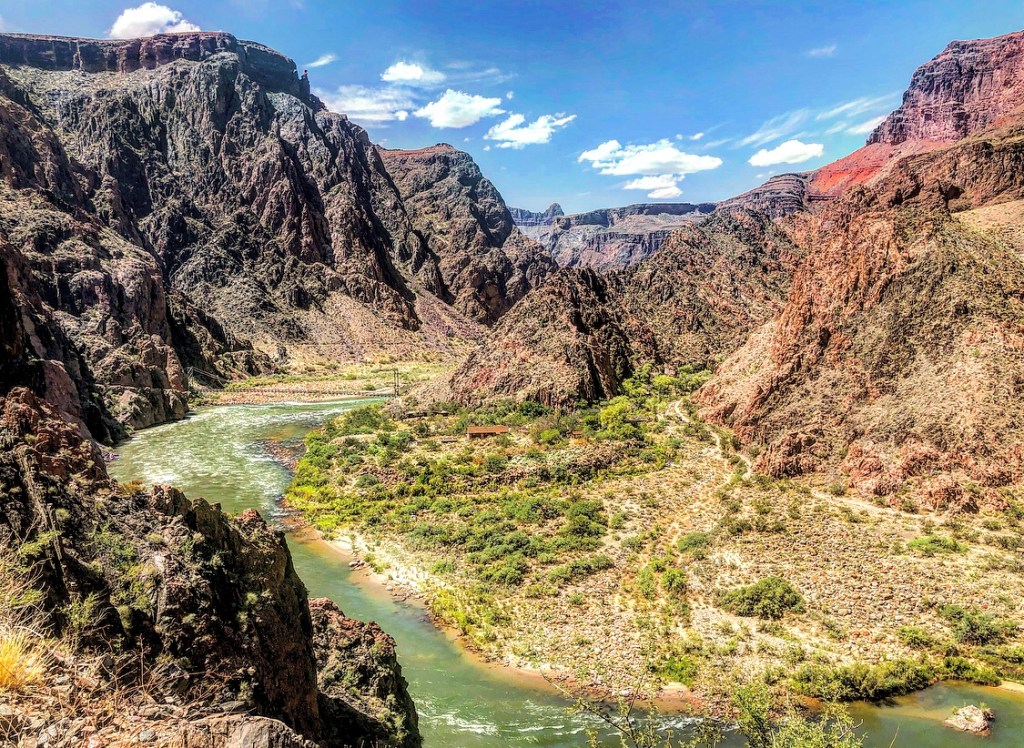 Colorado River at the bottom of the Grand Canyon with cliffs on either side.